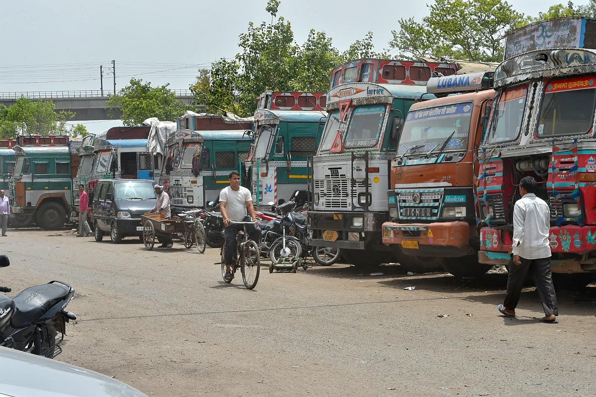 Trucks stand idle at Azadpur Subzi Mandi, in New Delhi on Monday, June 18, 2018. Truck owners and operators are protesting against fuel price hike and third party insurance premium hike in a nationwide strike today. ( PTI Photo/ Shahbaz Khan) 