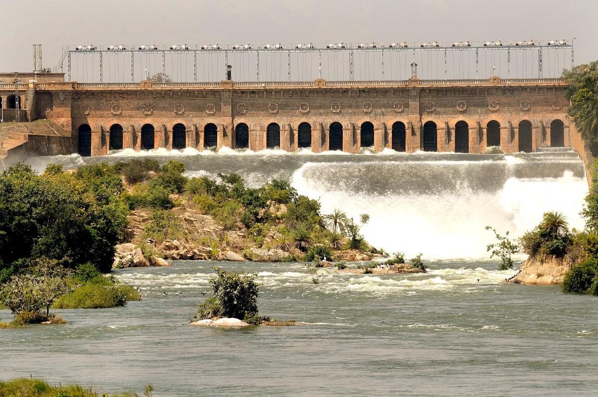 Water gushes from the crest gate of the KRS Dam in Srirangapatna Taluk, Mandya district. (DH file photo)