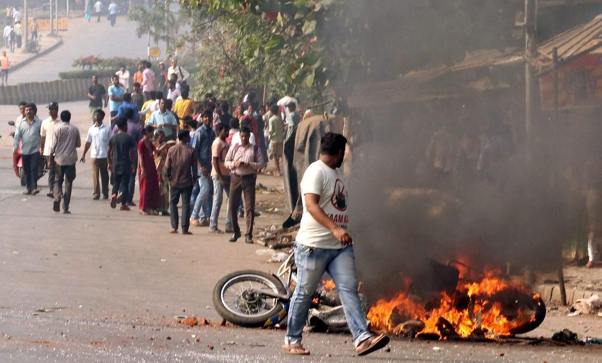 Protesters burn a bike at Vikroli in Mumbai during a protest over Bhima-Koregaon violence. (PTI File Photo)