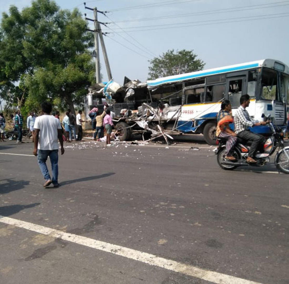 The mangled remains of the ill-fated TSRTC bus, near Karimnagar on Tuesday.