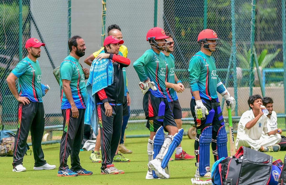 Afghan players during a practice session ahead of the maiden cricket test match between India and Afghanistan, in Bengaluru on Tuesday. (PTI Photo/Shailendra Bhojak)