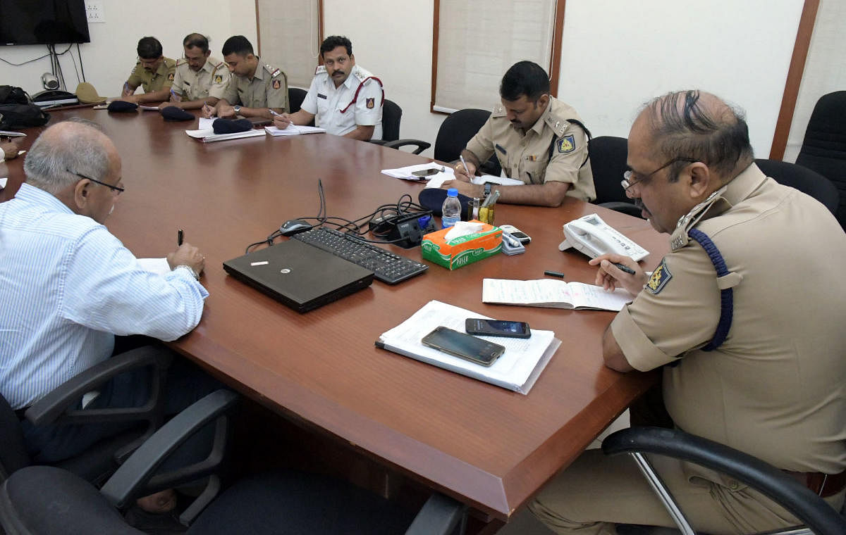 City Police Commissioner T R Suresh during the phone-in programme in Mangaluru on Friday.