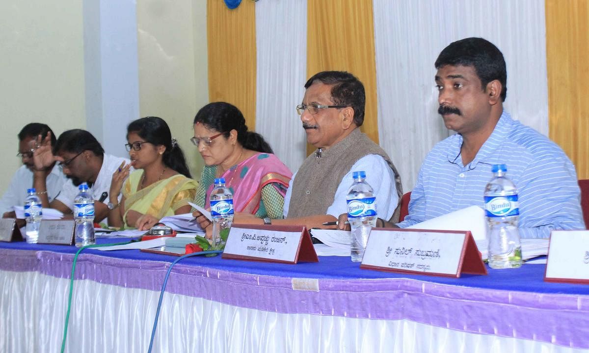 MLA K G Bopaiah chairs quarterly KDP meeting of Madikeri taluk panchayat on Saturday.
