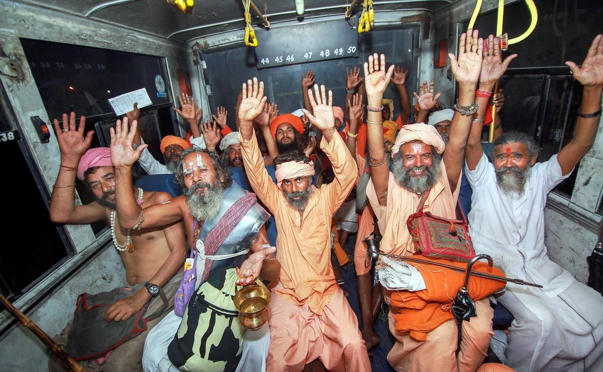 Sadhus chant religious slogans as they resume the yatra after it was suspended due to bad weather, in Jammu. (PTI Photo)