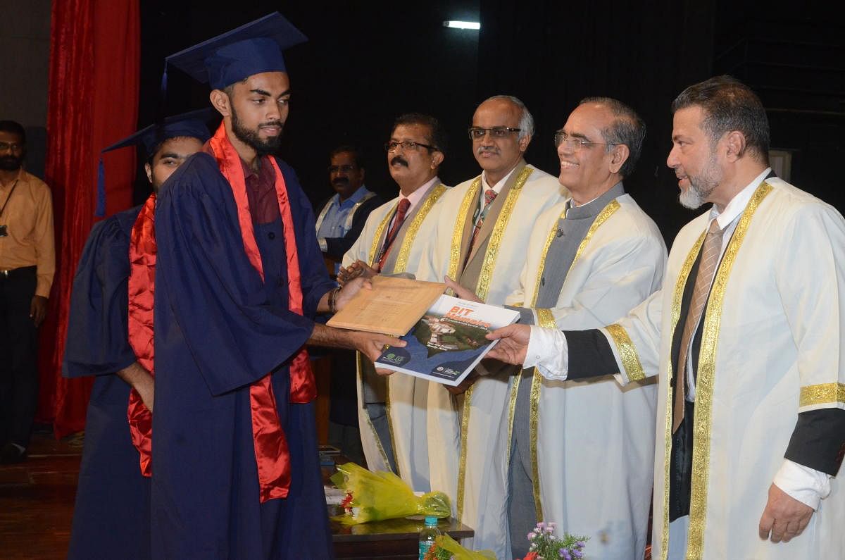 A student receives his degree from Nitte Deemed to be University Pro-Chancellor Dr M Shantaram Shetty during the convocation at Bearys Institute of Technology, Mangaluru.