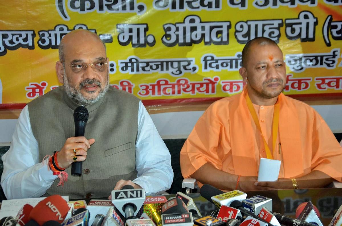 BJP president Amit Shah addresses the media during the state party workers meeting as Uttar Pradesh Chief Minister Yogi Adityanath looks on, in Mirzapur on Wednesday. (PTI File Photo)