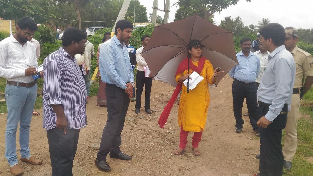 Deputy Commissioner P I Sreevidya visits Diddalli evacuees rehabilitation centre at Basavanahalli on Friday.