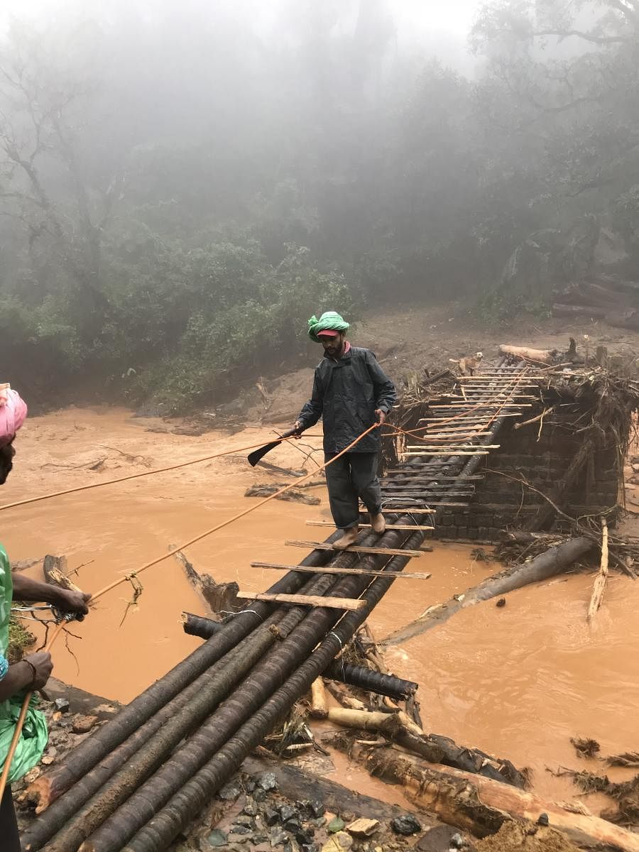 A makeshift footbridge is the only way for connectivity in Second Monnangeri in Madikeri. DH PHOTO