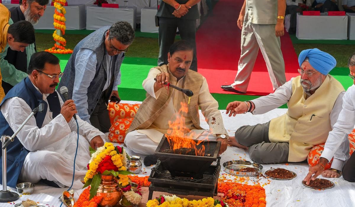 Minister of State for Culture Mahesh Sharma and Minister of Housing and Urban Affairs Hardeep Singh Puri perform a puja at the foundation stone laying ceremony for the construction of a museum for all Prime Ministers of the country, on the premises of the Teen Murti, in New Delhi on Monday. PTI