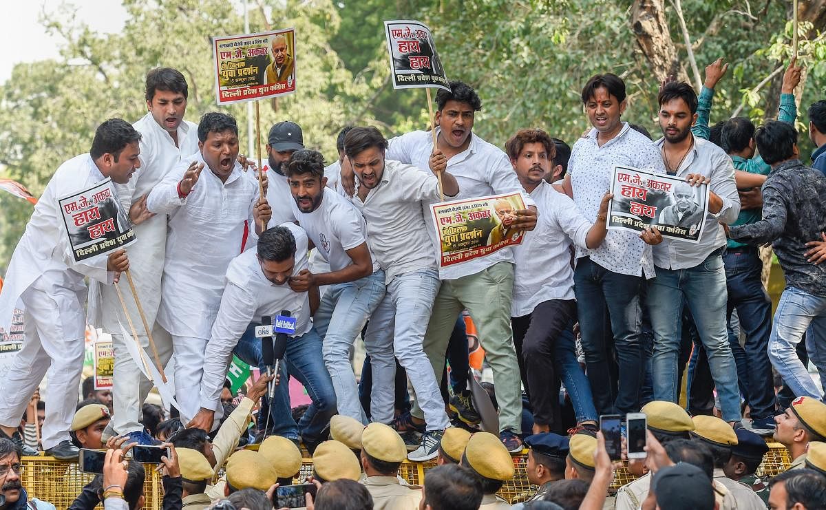 Delhi Pradesh Youth Congress members protest against MoS for External Affairs, M J Akbar for his reported sexual misconduct and harassment of women journalists, in New Delhi on Monday. PTI