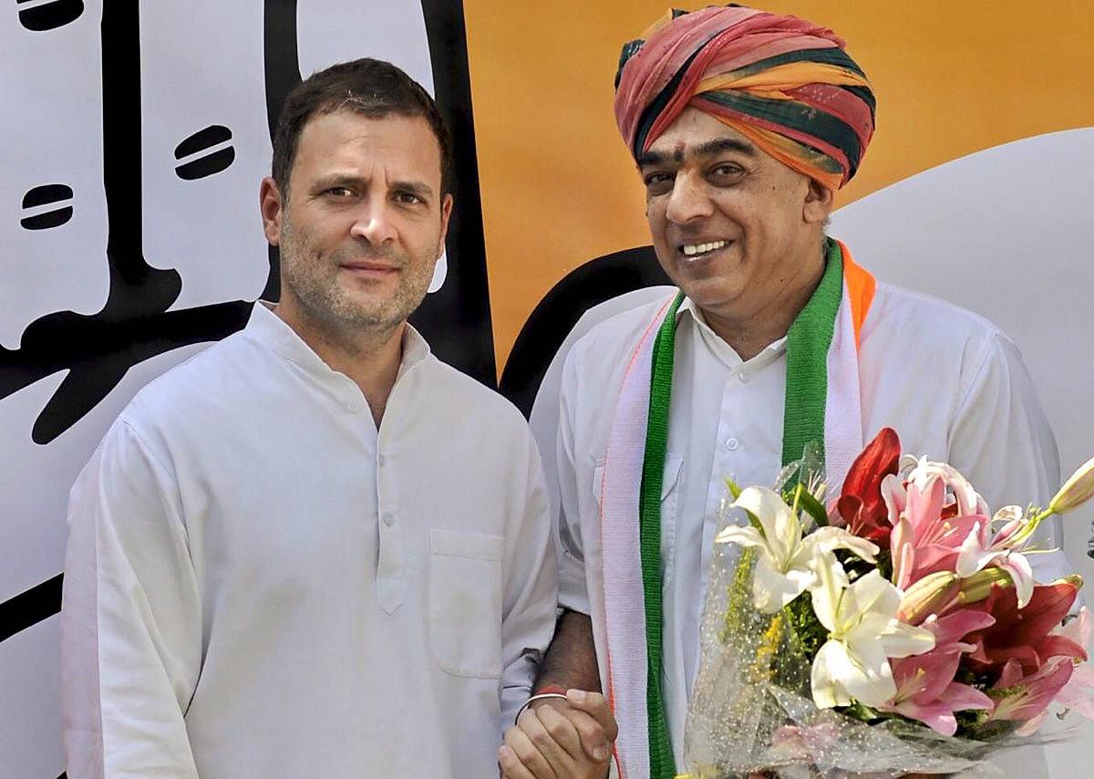Congress President Rahul Gandhi welcomes veteran BJP leader Jaswant Singh’s son Manvendra Singh as he joins Congress party, in New Delhi, on Wednesday. PTI photo
