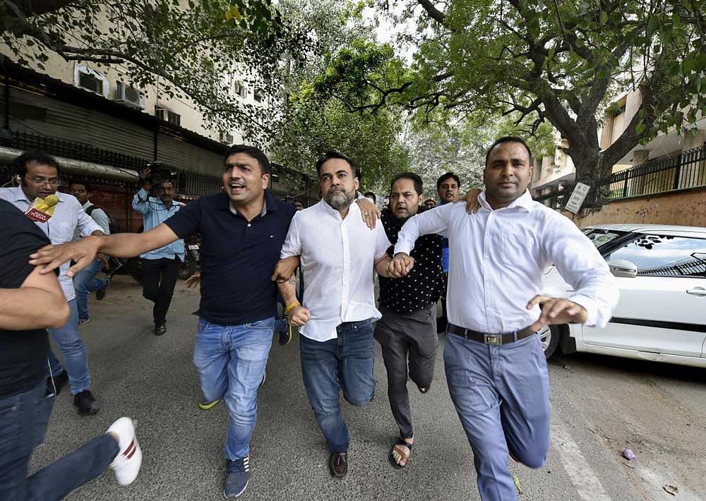 Ashish Pandey, accused of brandishing gun at guests outside a hotel, being brought out of the Patiala House Courts in New Delhi, Thursday, Oct 18, 2018. He has been sent to one-day police remand. PTI Photo