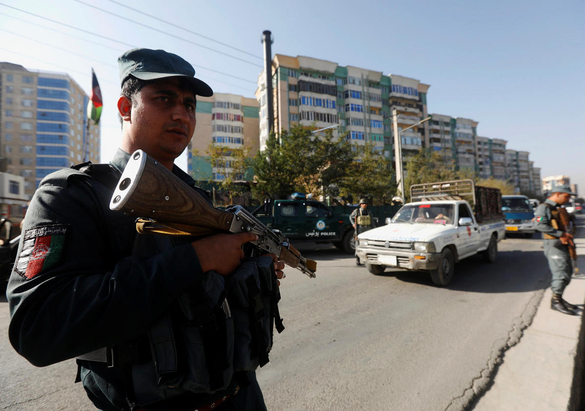 Afghan policemen stand guard at a checkpoint a day before parliamentary elections in Kabul, Afghanistan October 19, 2018. (Reuters Photo)