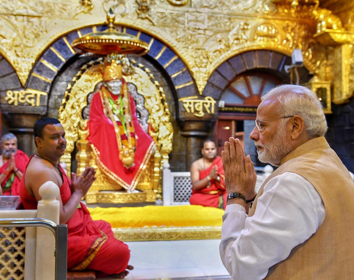 Prime Minister Narendra Modi offers prayers at Shri Sai Baba Temple in Shirdi, Maharashtra. (PTI photo)