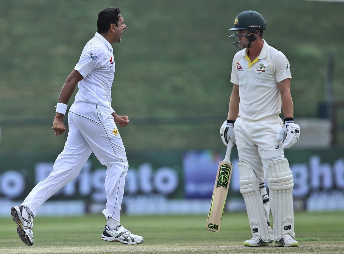 Pakistan's Mohammad Abbas (left) celebrates the dismissal of Australia's Travis Head in the second Test on Friday. AP/PTI