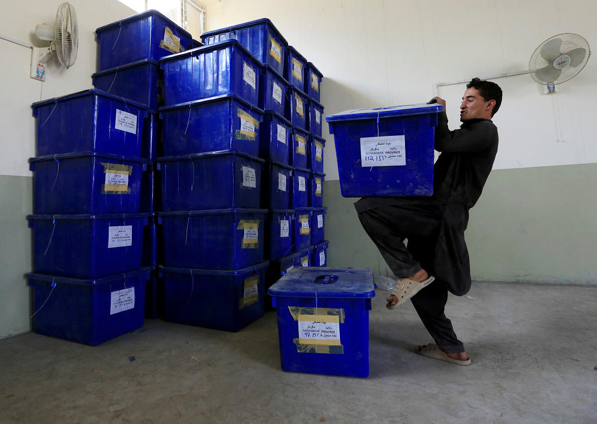 An Afghan election commission worker prepares ballot boxes and election material to send to the polling stations at a warehouse in Jalalabad, Afghanistan October 19, 2018. (Reuters Photo)