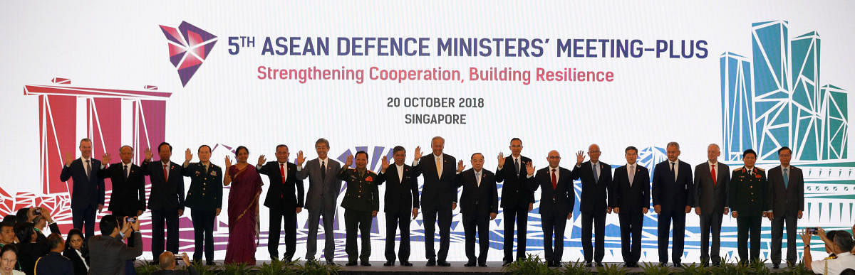 Defence Ministers pose for group photo at ASEAN defence ministers meeting in Singapore. Reuters photo