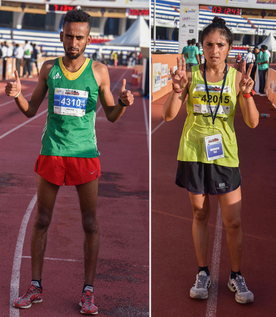 VICTORIOUS Ethiopia’s Mikiyas Yemata (left) and Aneeta Chaudhary of India won the men’s and women’s titles respectively in the Bengaluru Marathon at the Sree Kanteerava Stadium on Sunday. DH Photo/ S K Dinesh