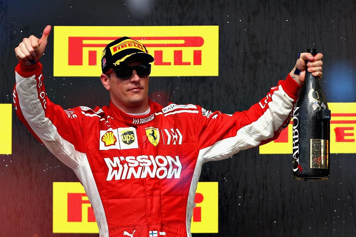 Race winner Kimi Raikkonen of Finland and Ferrari celebrates on the podium during the United States Formula One Grand Prix at Circuit of The Americas on Sunday, in Austin. (AFP)