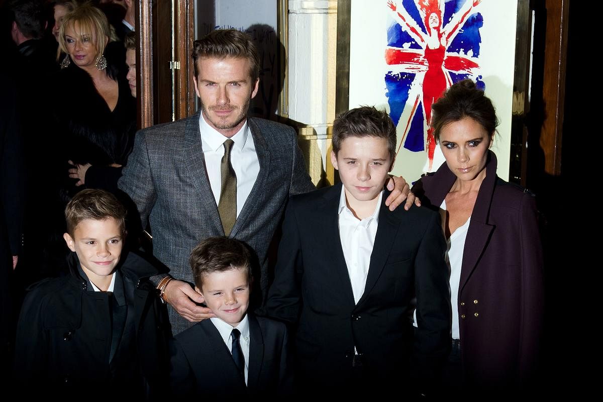 David and Victoria Beckham pose on the red carpet with three of their children in London on December 11, 2012. AFP File