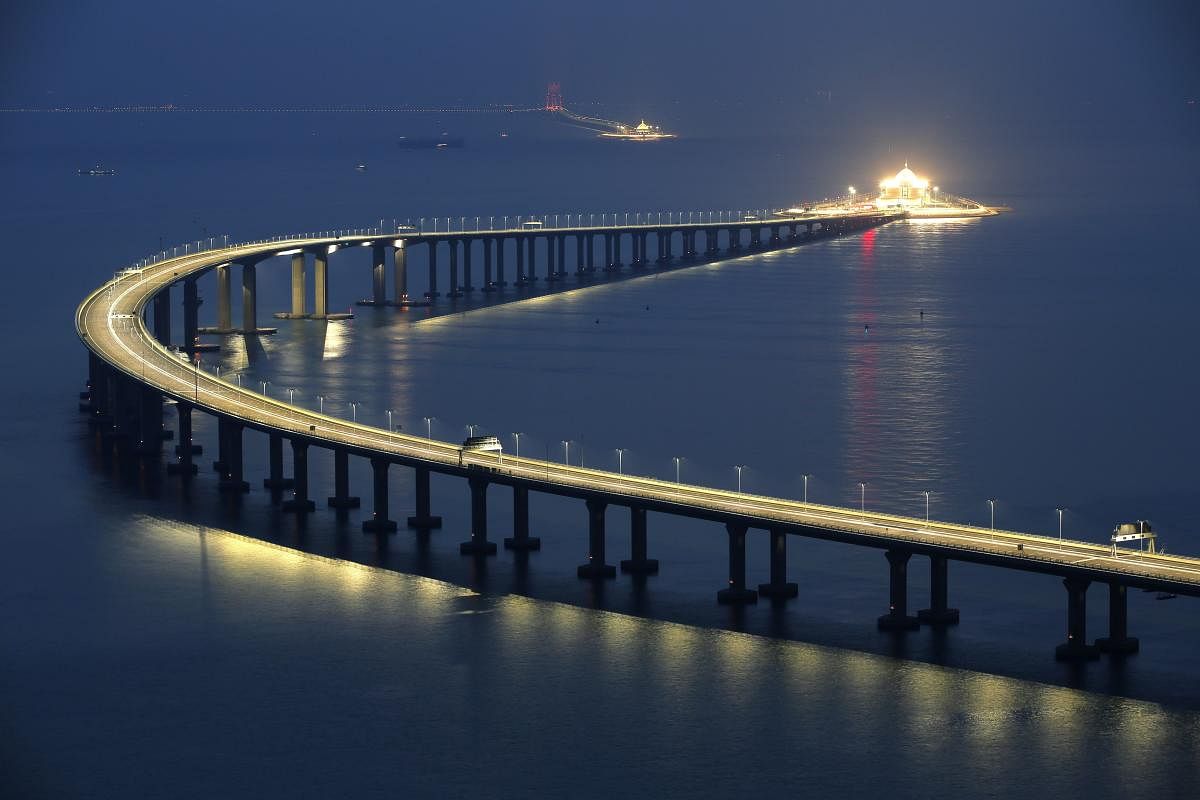 Hong Kong: The Hong Kong-Zhuhai-Macau Bridge is lit up in Hong Kong, Monday, Oct. 22, 2018. The bridge, the world's longest cross-sea project, which has a total length of 55 kilometers (34 miles), will have opening ceremony in Zhuhai on Oct. 23. AP/PTI(AP