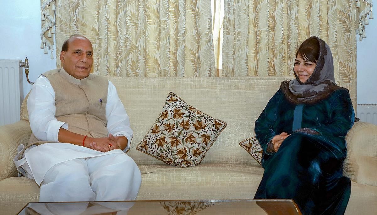 Union Home Minister Rajnath Singh with the President of the Jammu and Kashmir Peoples Democratic Party Mehbooba Mufti in Srinagar on Tuesday. PTI