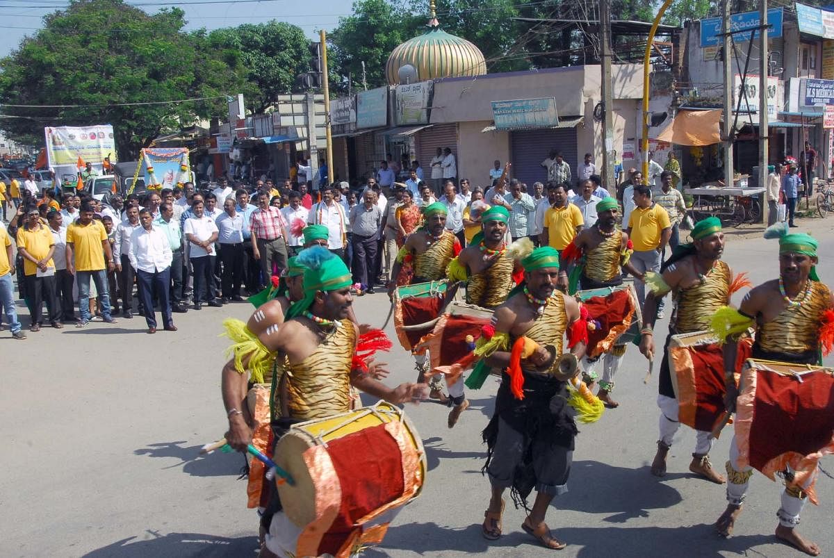 Folk artistes take part in a procession taken out as part of Valmiki Jayanti programme in Chikkamagaluru.