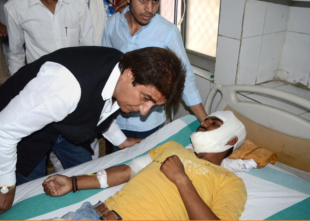 Uttar Pradesh Congress president Raj Babbar meets an injured victim of the flyover collapse incident, at a hospital in Varanasi, on Wednesday. PTI