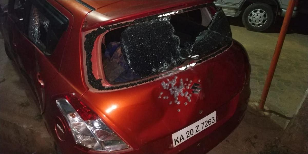 The hatchback of dacoits' car damaged by bullets fired by police. DH photo.