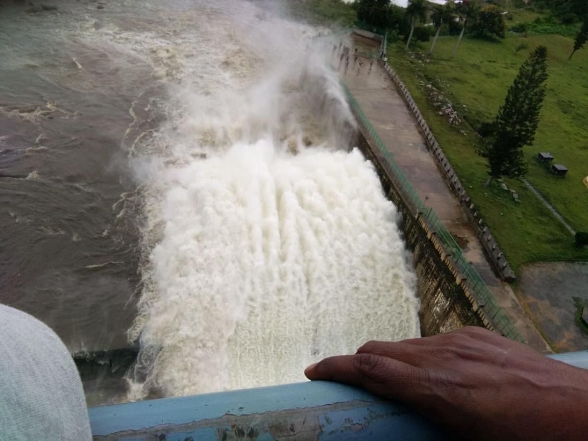 Water gushes out of a crest gate at Hemavathi reservoir at Gorur in Hassan district. Six crest gates were opened after the dam reached its full reservoir level on Saturday. (DH Photo)
