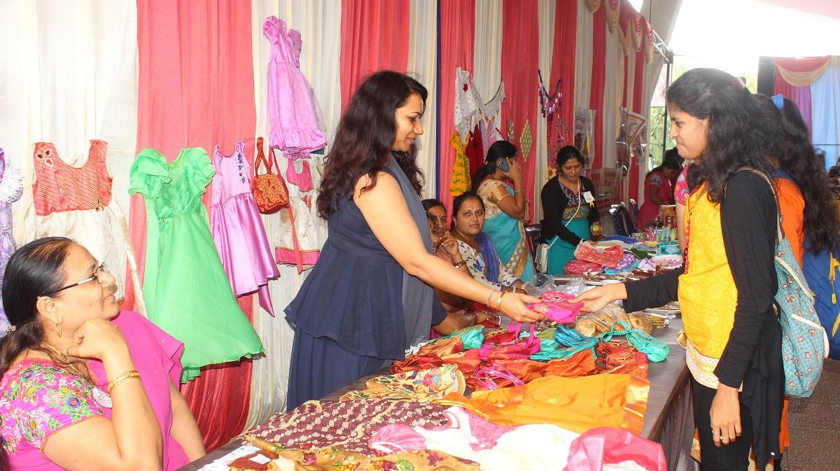 Micro-entrepreneurs display their products at 'Namodyami Sammelana' held at Deshpande Foundation in Hubballi on Monday.