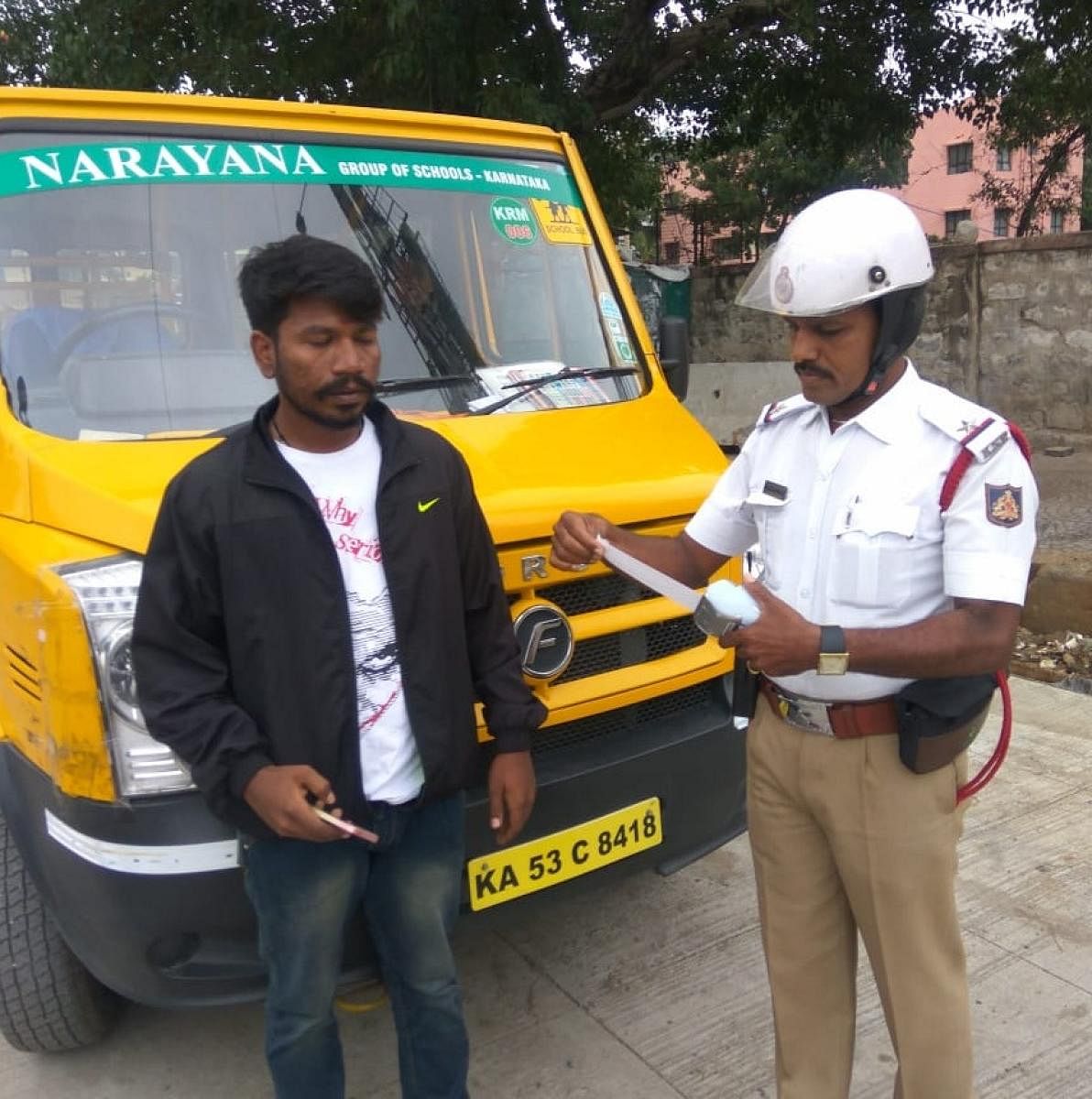 A school van driver booked by a traffic police officer on Monday.