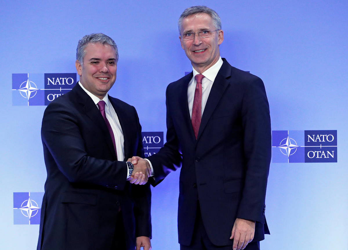 Colombian President Ivan Duque Marquez is welcomed by Nato Secretary General Jens Stoltenberg at the Alliance headquarters in Brussels, Belgium on October 23, 2018. Reuters