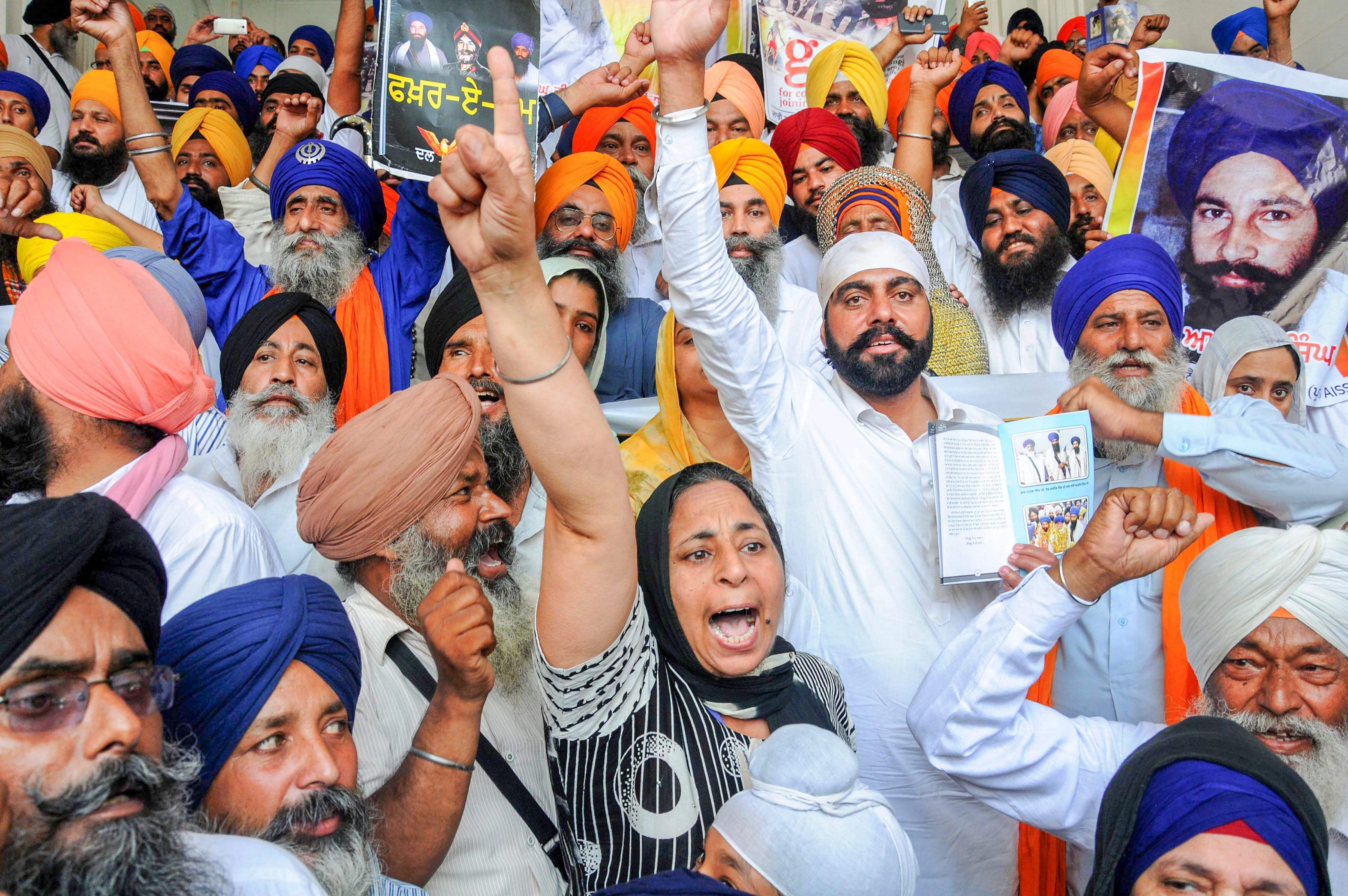Supporters of radical Sikh organisations shout pro-Khalistan slogans at a demonstration marking the 34th anniversary of the Operation Blue Star,1984, at Golden Temple in Amritsar on Wednesday. PTI