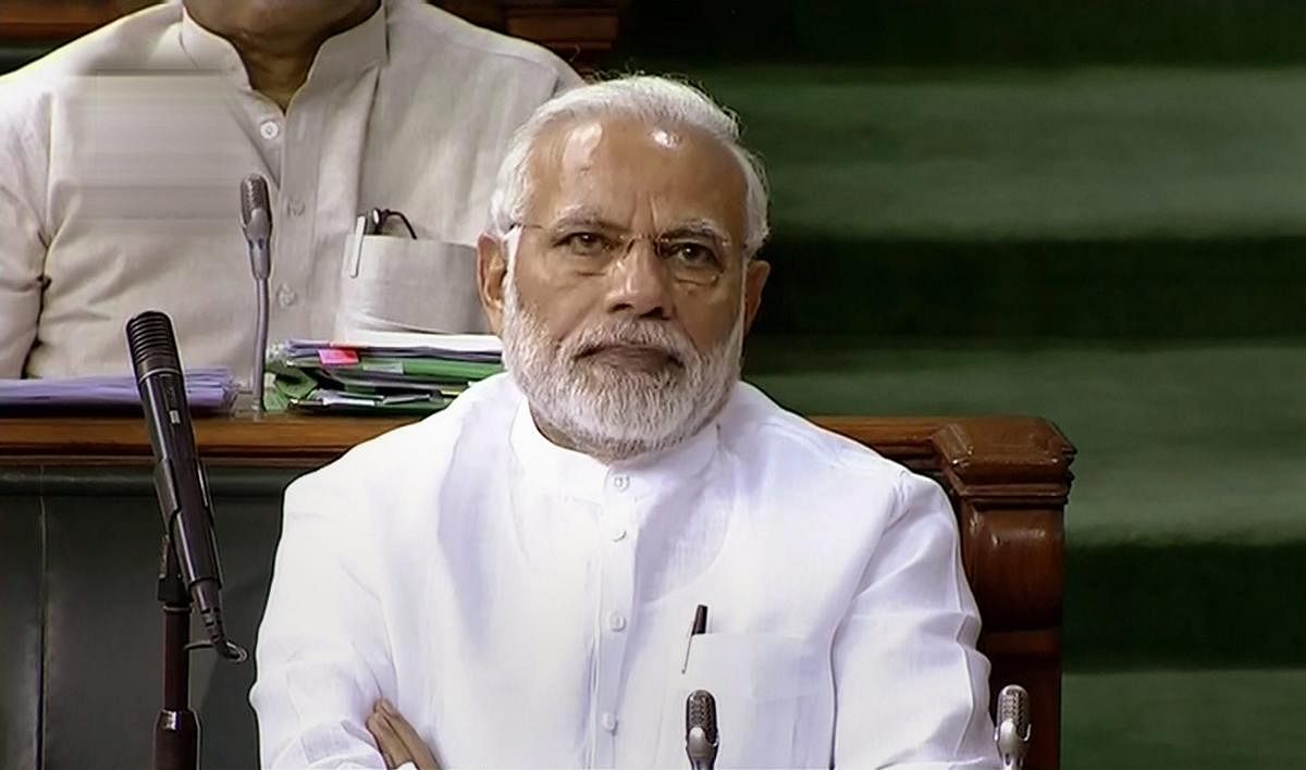Prime Minister Narendra Modi attends the first day of the Monsoon session of Lok Sabha, at the Parliament in New Delhi on Wednesday. (PTI/TV Grab)