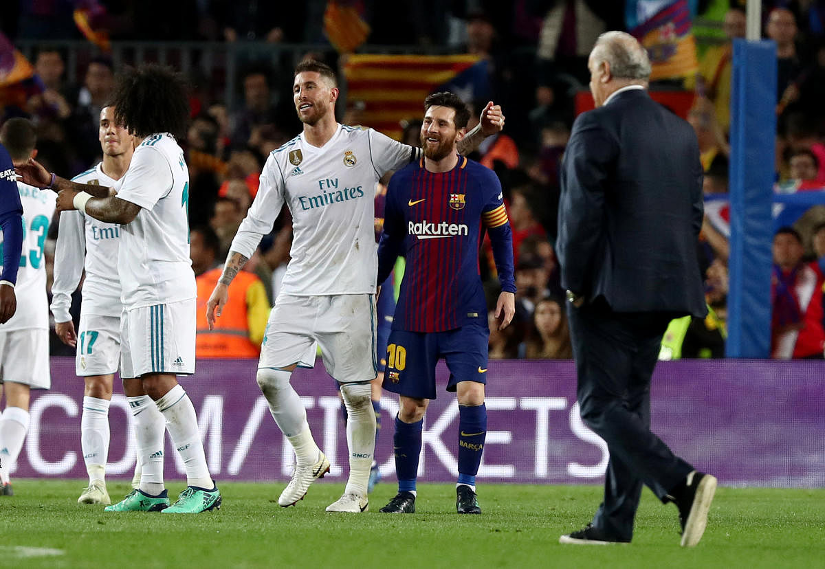 Barcelona's Lionel Messi (right) with Real Madrid's Sergio Ramos at the end of the match. REUTERS