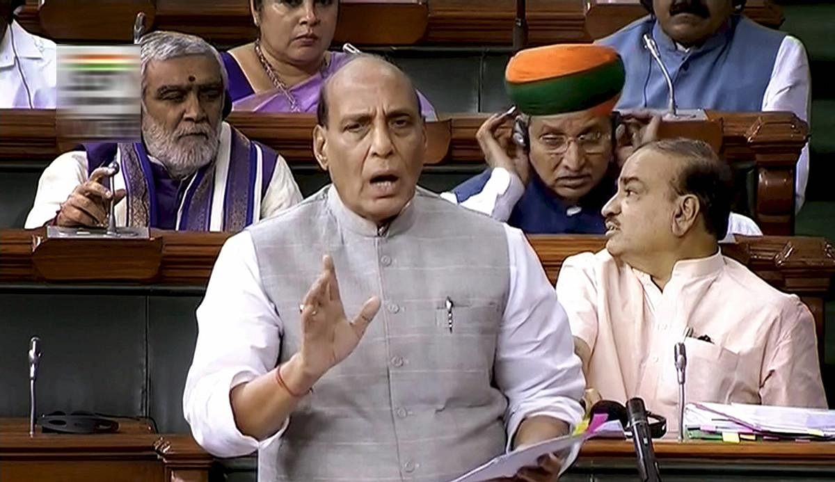 Home Minister Rajnath Singh speaks in the Lok Sabha during the Monsoon session of Parliament, in New Delhi on Thursday. PTI Photo