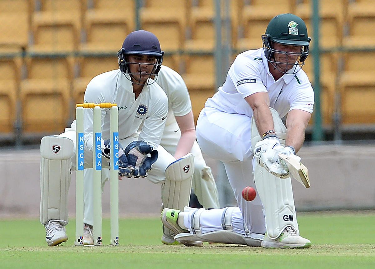 FINE KNOCK: Sarel Erwee of South Africa A sweeps one to the fence en route to his 117 (retired hurt) against Board President's XI at the Chinnaswamy stadium on Monday. DH PHOTO