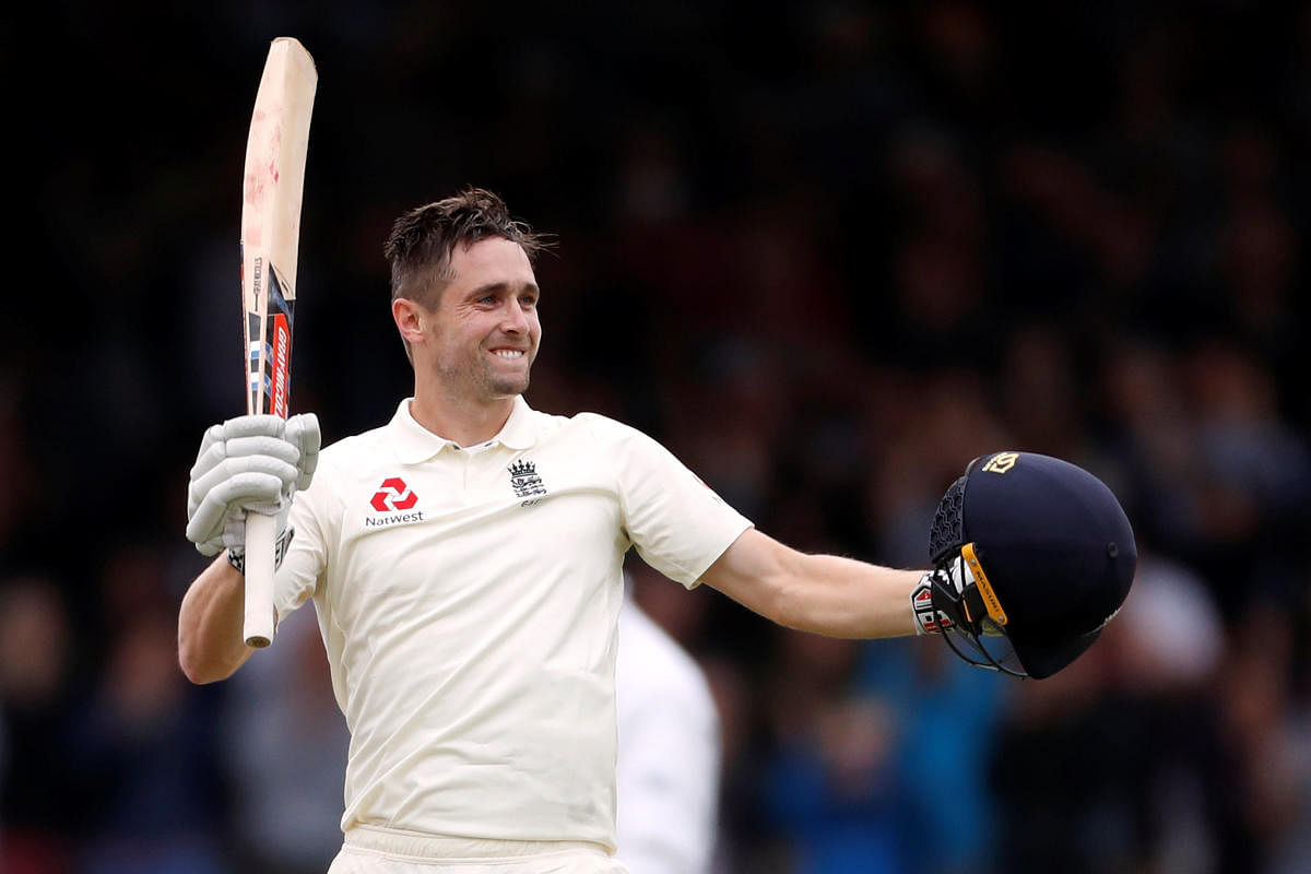England's Chris Woakes celebrates after reaching his maiden Test hundred against India on the third day of the second Test at Lord's in London on Saturday. Reuters