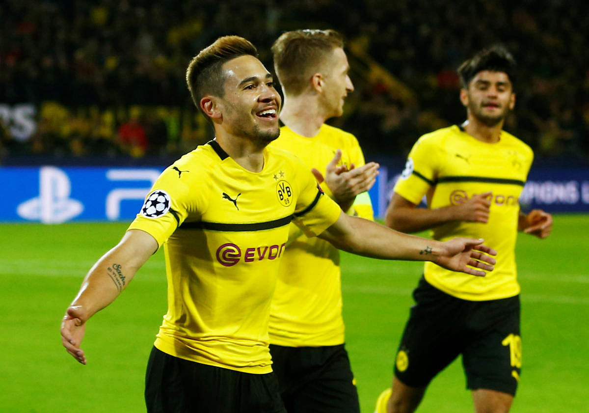 NIGHT TO SAVOUR: Borussia Dortmund's Raphael Guerreiro (left) celebrates after against Atletico Madrid during their Champions League game on Wednesday. REUTERS