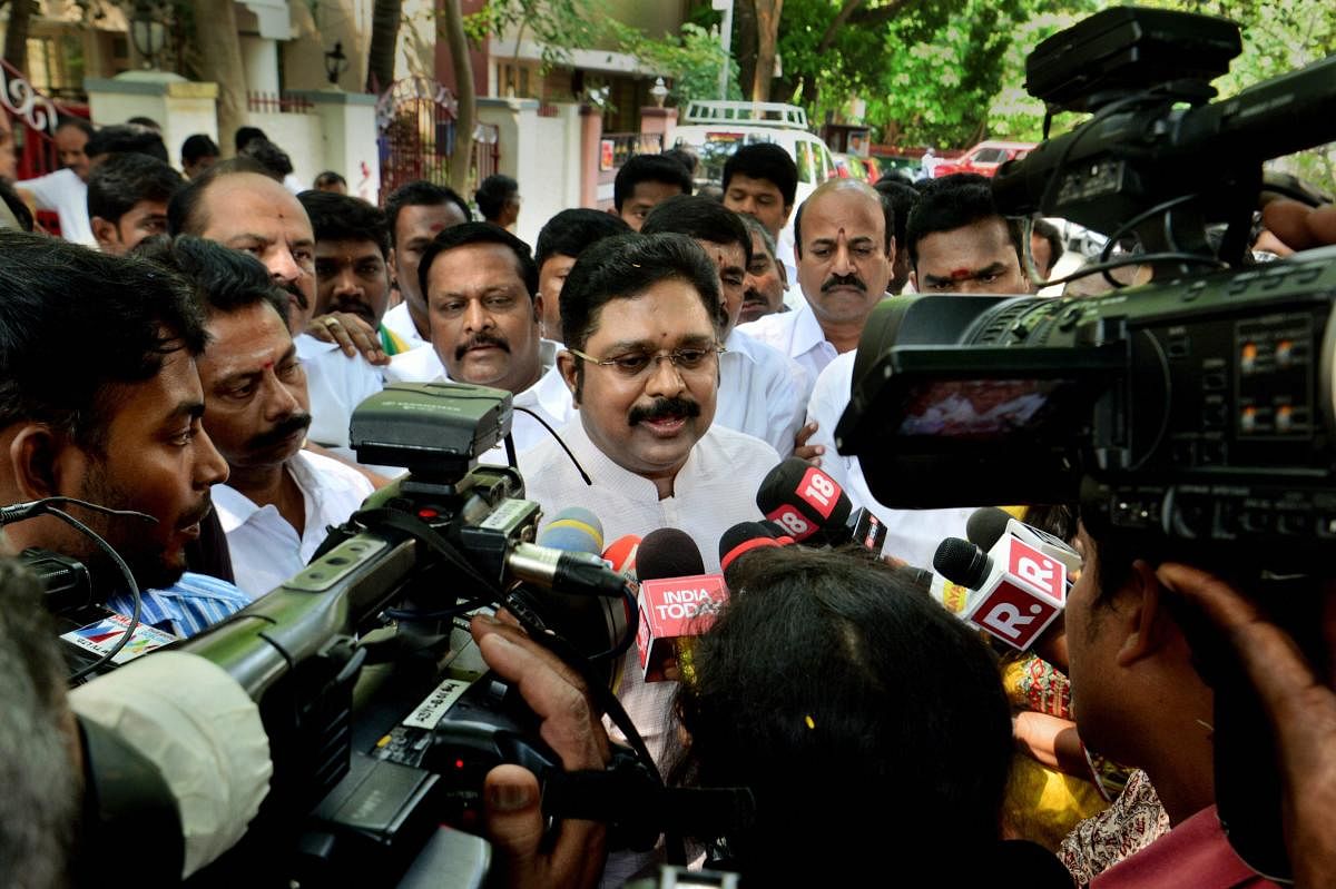 Amma Makkal Munetra Kazhagam chief TTV Dhinakaran reacts before the media on Madras High Court's verdict disqualifying 18 rebel MLAs of the ruling AIADMK, in Chennai, on Thursday. PTI