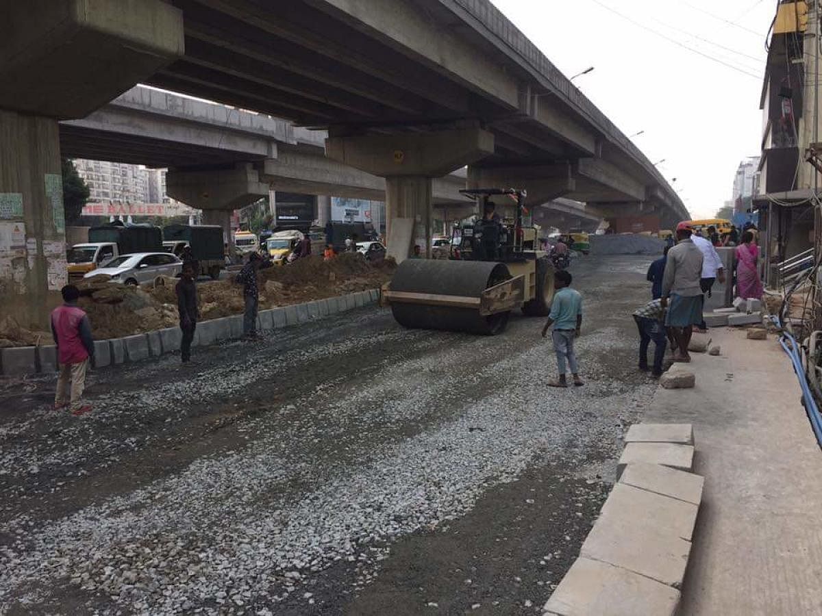 The much-awaited asphalting of a road under the Doddanekkundi flyover began on Wednesday.