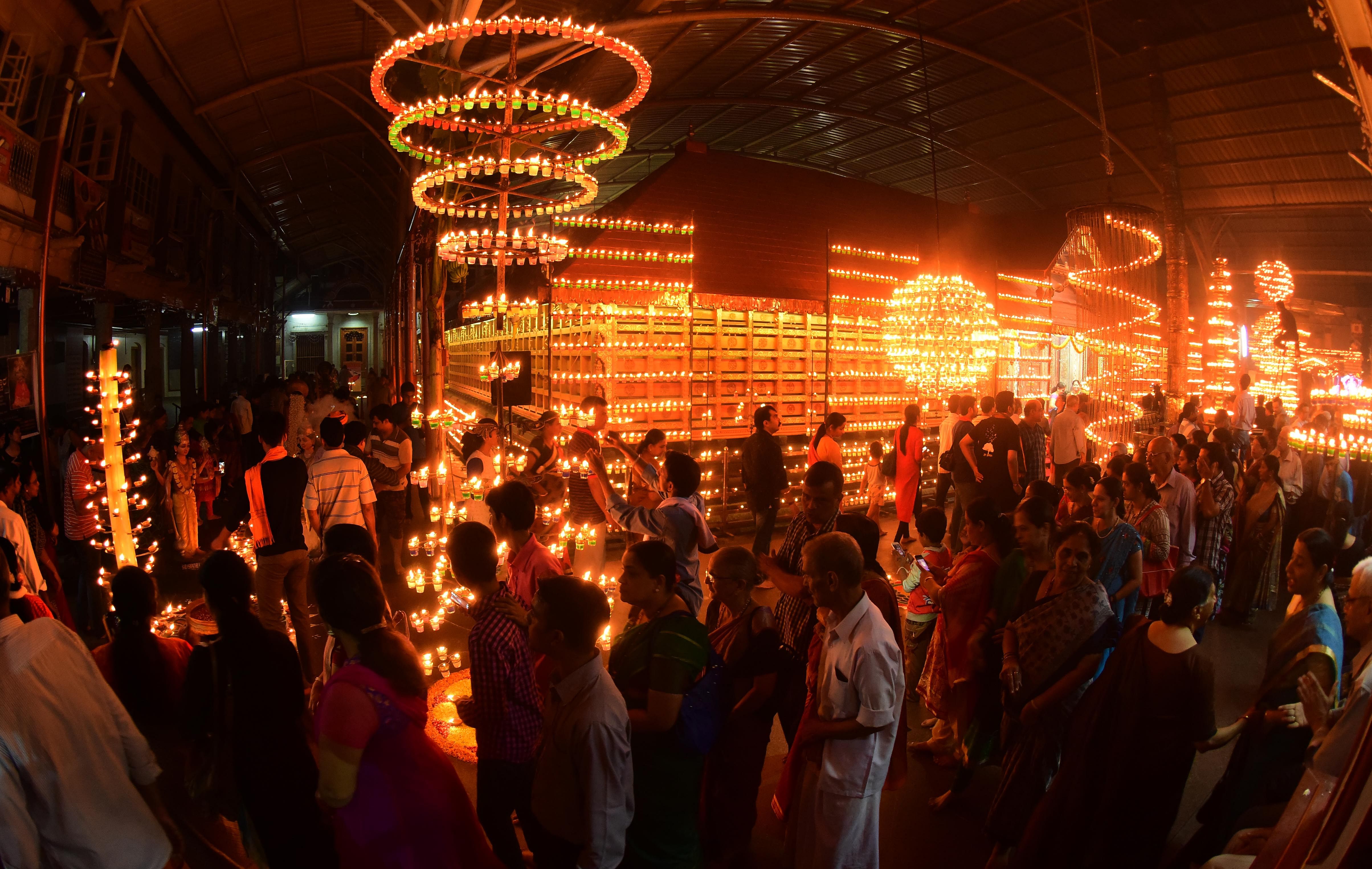 A large number of devotees turn up to witness the splendour of lights during the 'Deepotsava' at the Sri Venkataramana temple premises, in Mangaluru. (DH Photo/Sharadotsava committee)