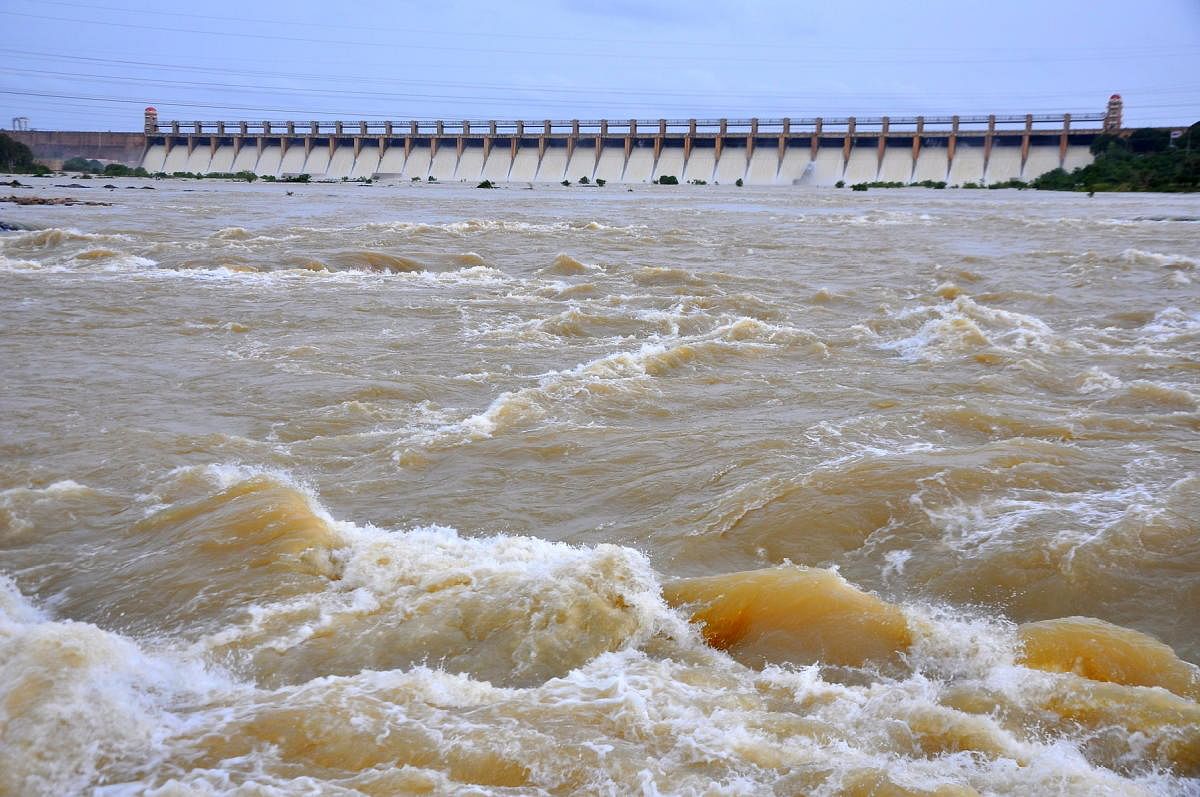 Water gushes out of all 33 crest gates of Tungabhadra reservoir near Hosapete on Sunday. (DH Photo/ B Babukumar)
