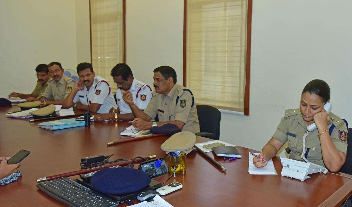 DCP (Crime and Traffic) Uma Prashanth responds to a telephone call during the phone-in programme organised by Mangaluru Police Commissionerate on Friday.