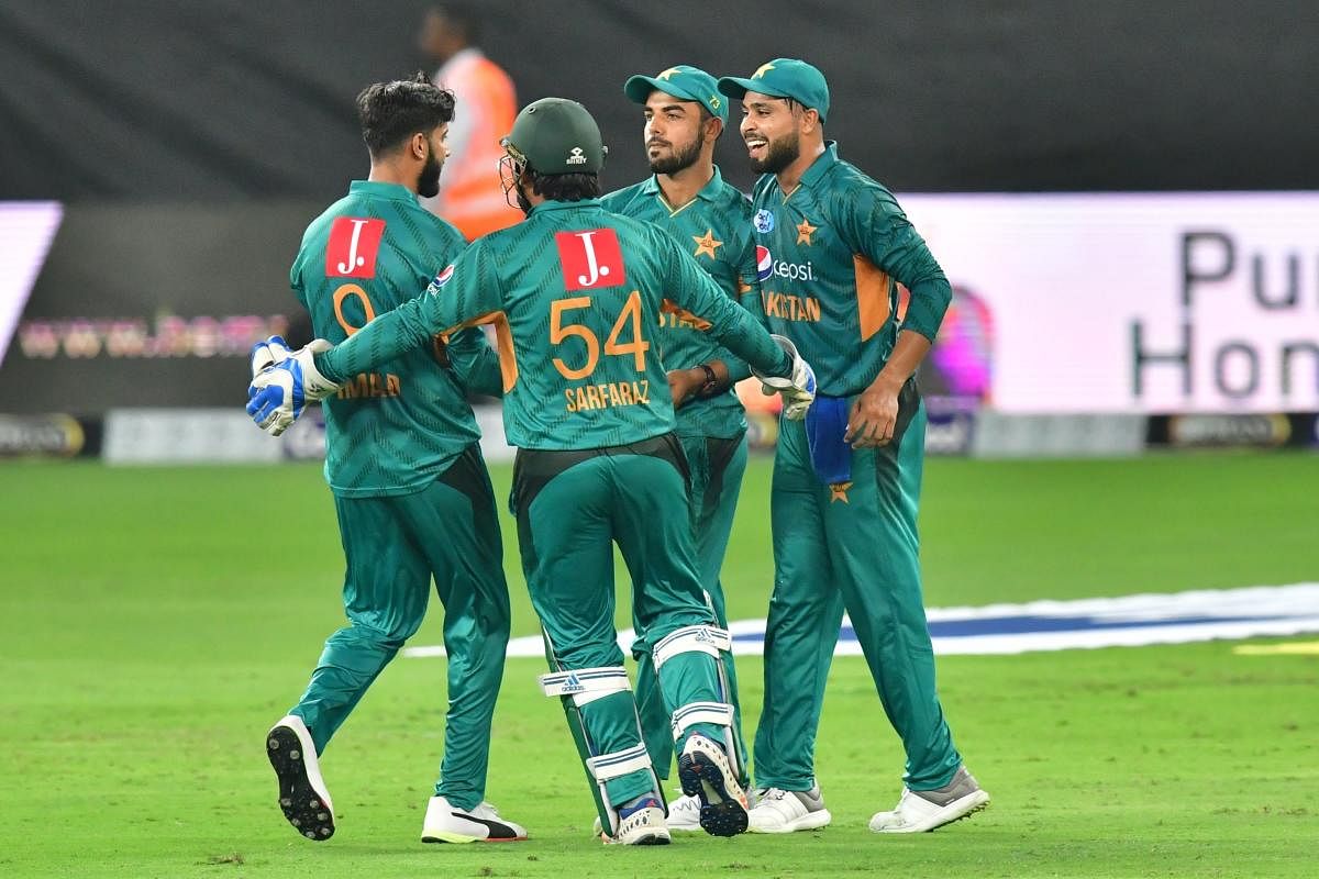 JOYOUS: Pakistan's Shadab Khan (centre) celebrates after dismissing Australia's Chris Lynn during the second T20 match. AFP