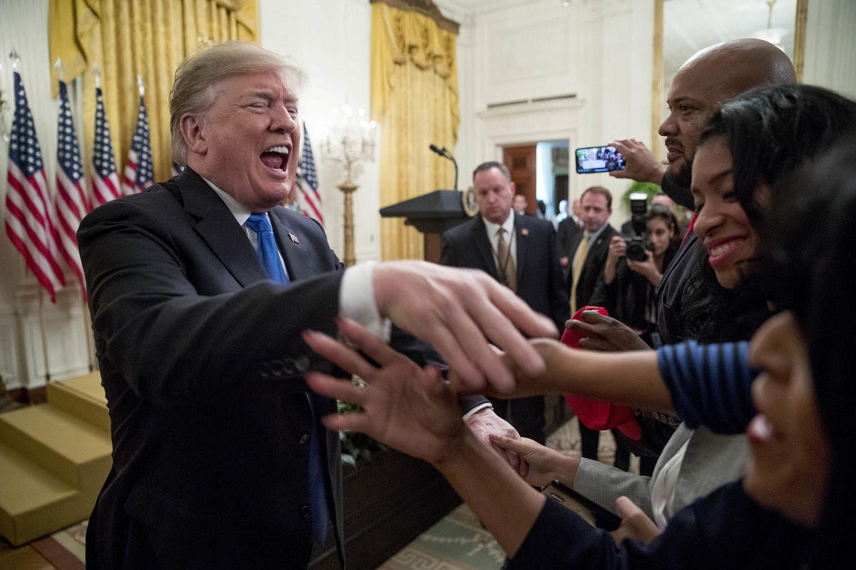 President Donald Trump greats members of the audience after speaking at the 2018 Young Black Leadership Summit in the East Room of the White House, Friday, Oct. 26, 2018, in Washington. (AP/PTI)