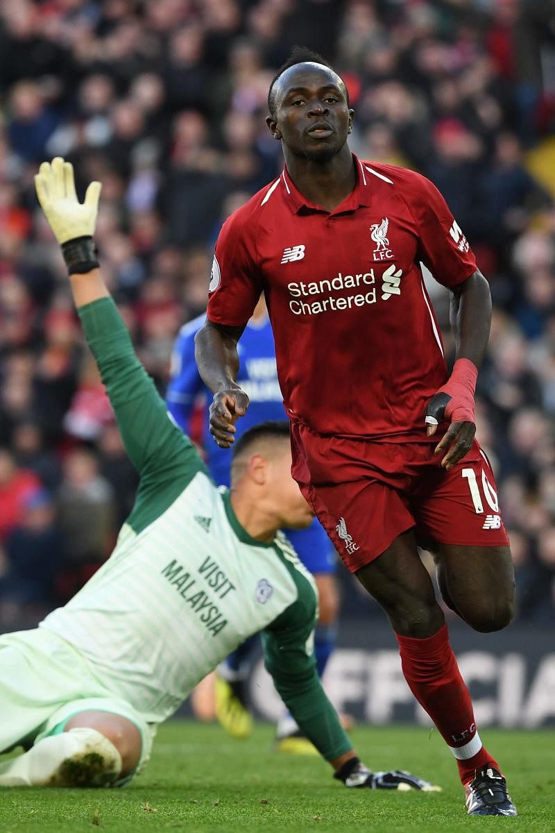 Liverpool’s Sadio Mane celebrates after scoring against Cardiff City. AFP