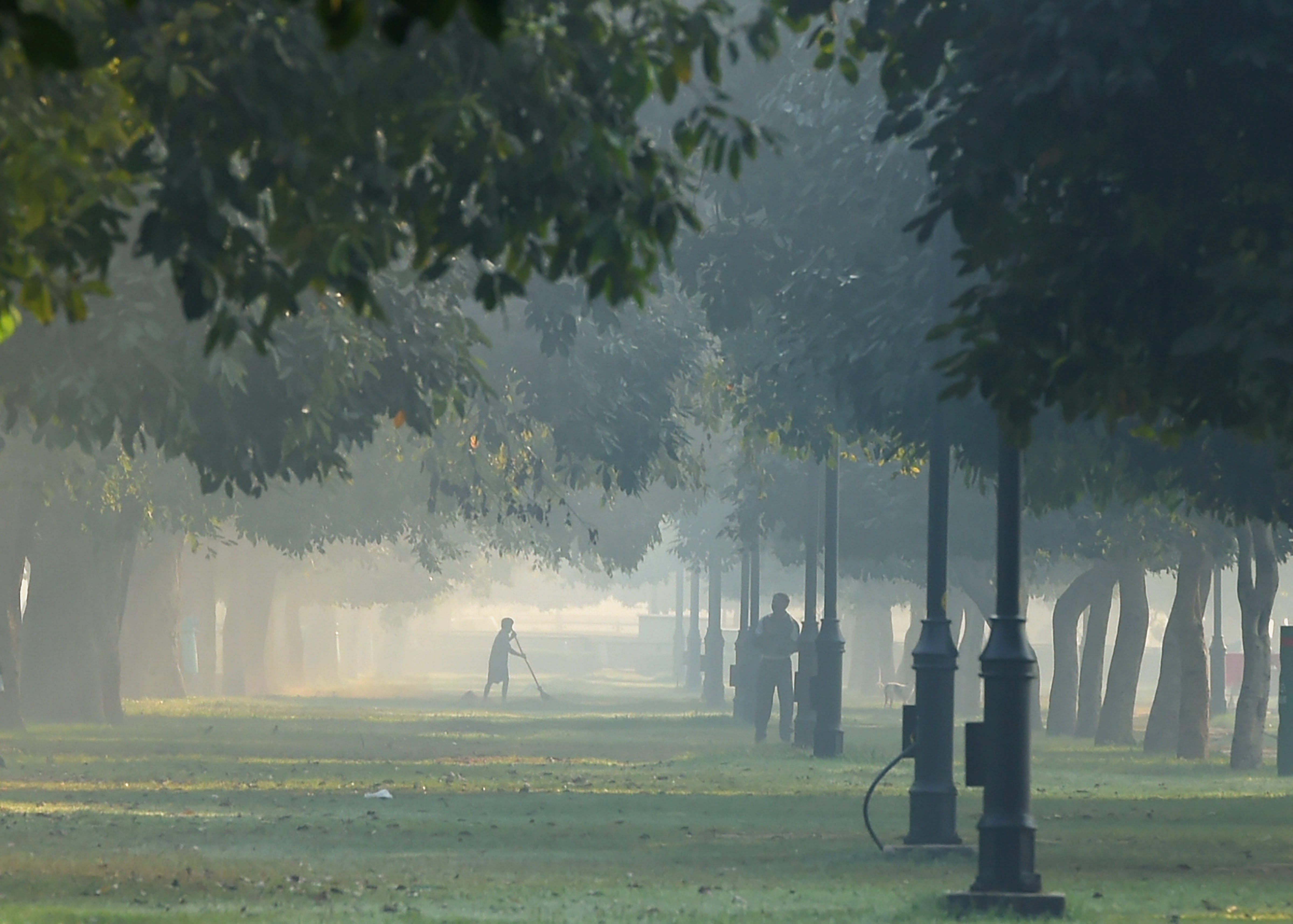 A view of Rajpath lawns engulfed in smog, in New Delhi, on Friday. The national capital is engulfed in haze and deadly air pollution with the onset of winters and festival season. PTI