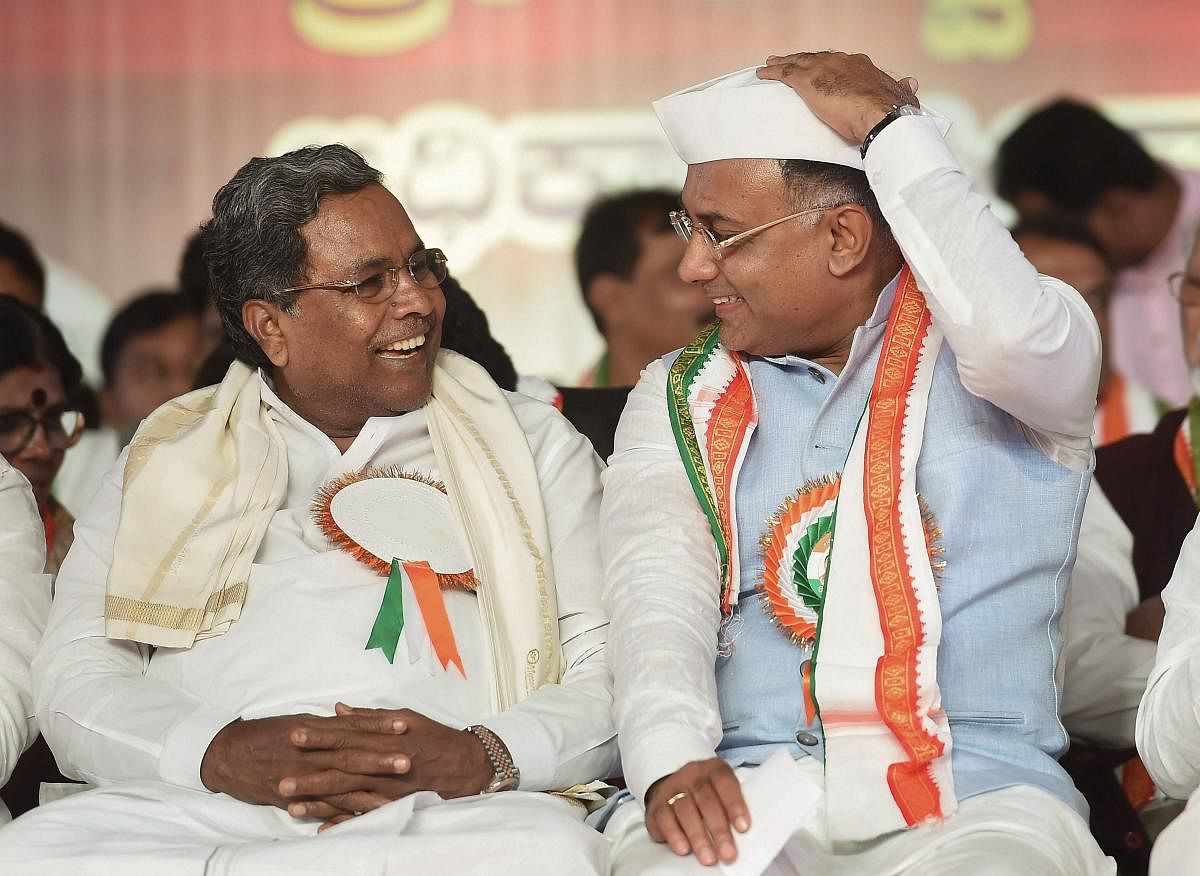 KPCC President Dinesh Gundu Rao with former Karnataka chief minister Siddaramaiah. PTI file photo.